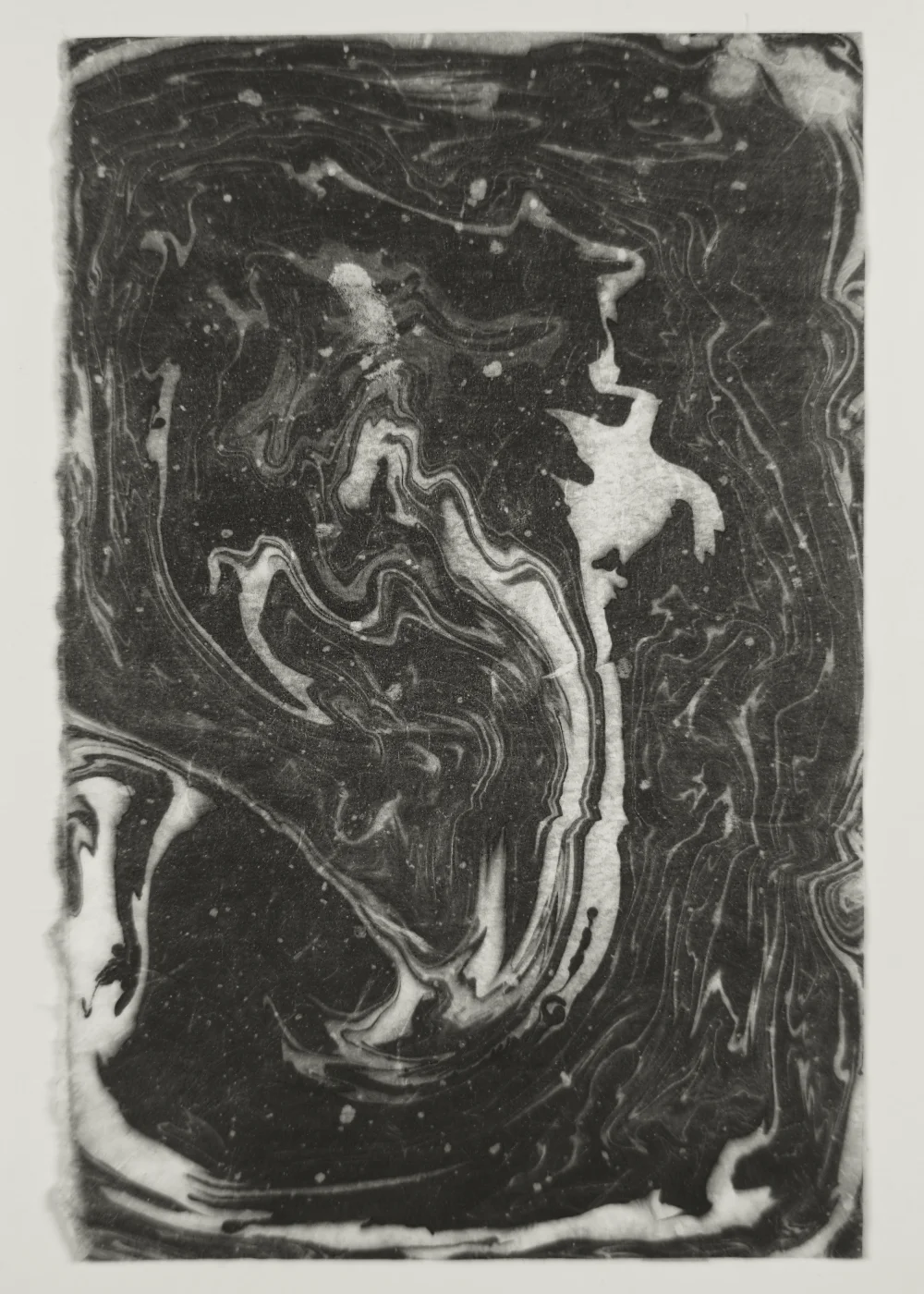 Suminagashi monoprint with delicate ink patterns on handmade washi paper