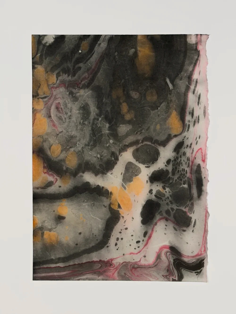 Translucent ink monoprint with layered strata-like forms on washi paper