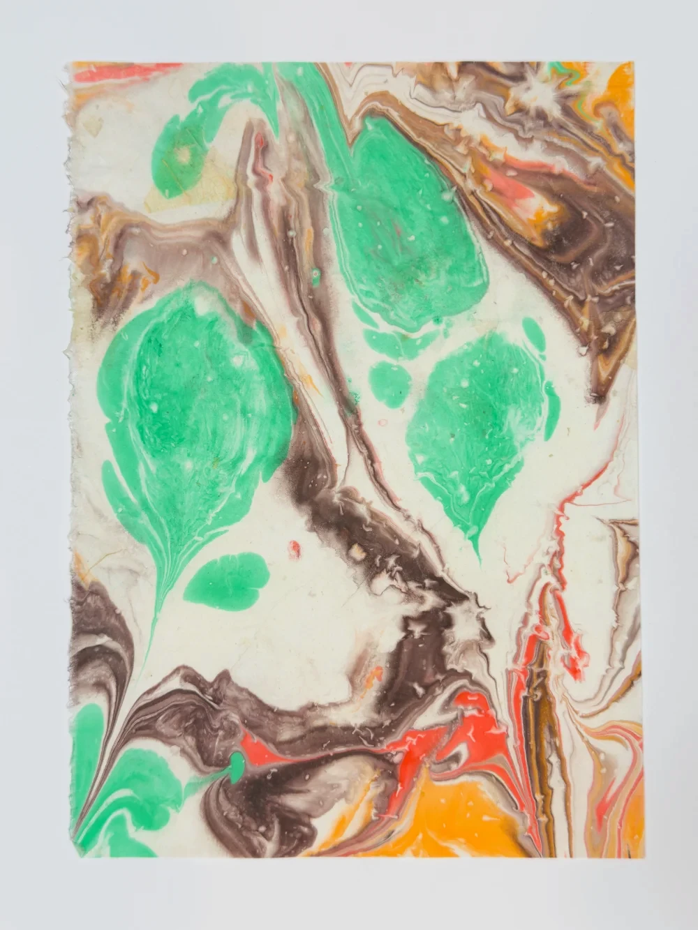 Color paper marbling monoprint with pooling pigments and coastal forms, diptych right