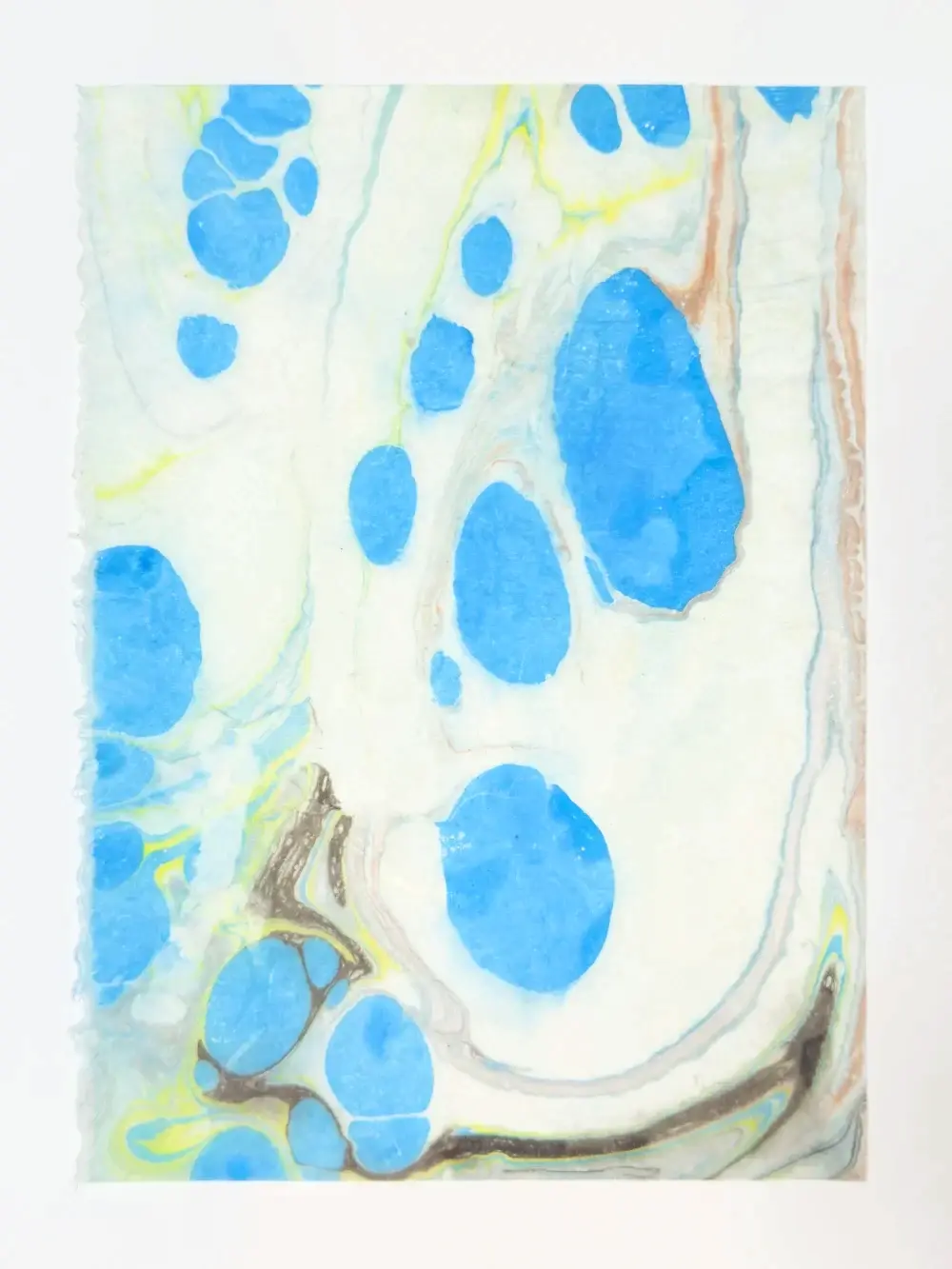 Blue pools and yellow threads on white with a dark tendril at lower left