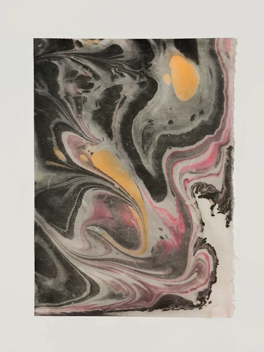 Paper marbling monotype with dense black and translucent strata patterns, left half