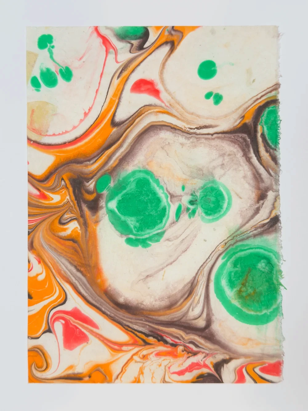 Color paper marbling monotype with pooling pigments and coastal forms, diptych left