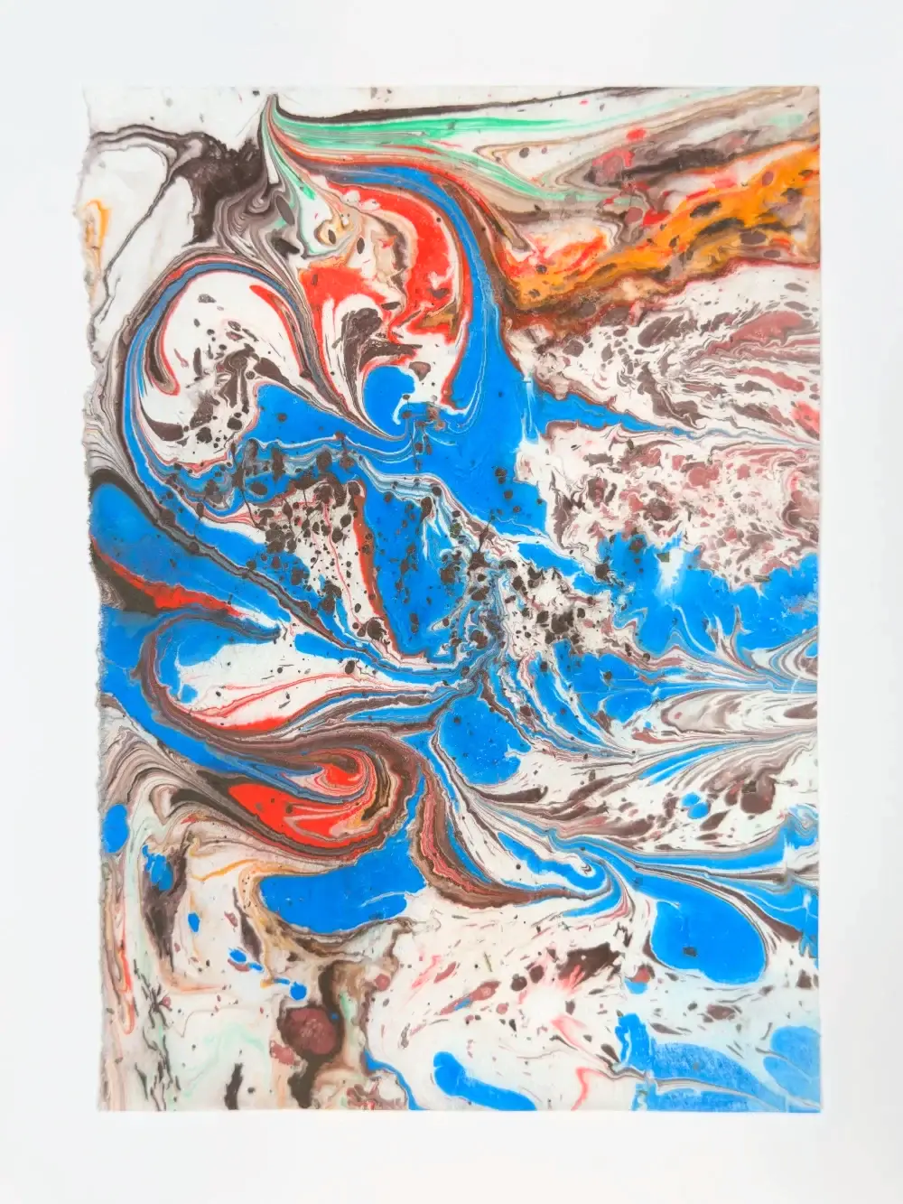 Blue and red swirls with dark brown spatter on white, energetic and turbulent