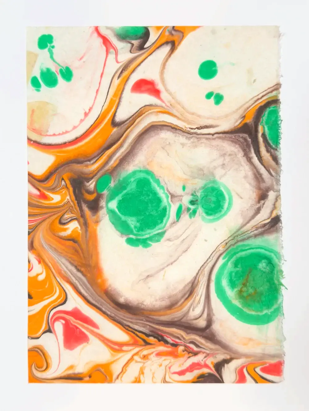 Green pools and orange ribbons swirling on cream ground