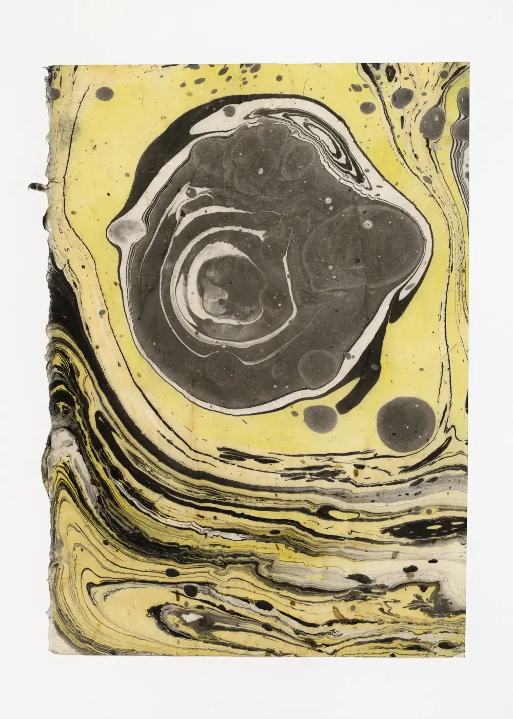 Dark central mass with concentric rings floating in yellow, horizontal banded movement below